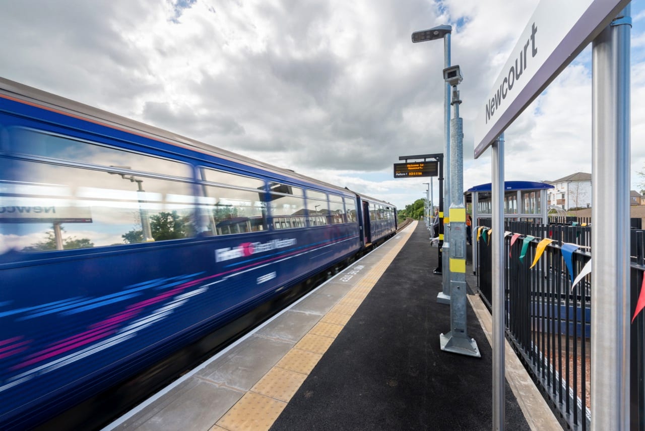 Train passing the new platform at Newcourt Station, Exeter